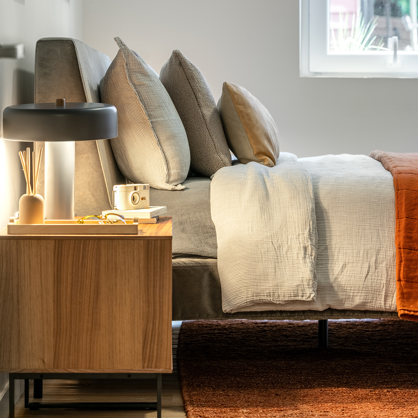 Bedroom with a nightstand and a lamp